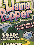 Llama Popper with pink ears and green blanket