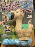 Llama Popper with pink ears and green blanket