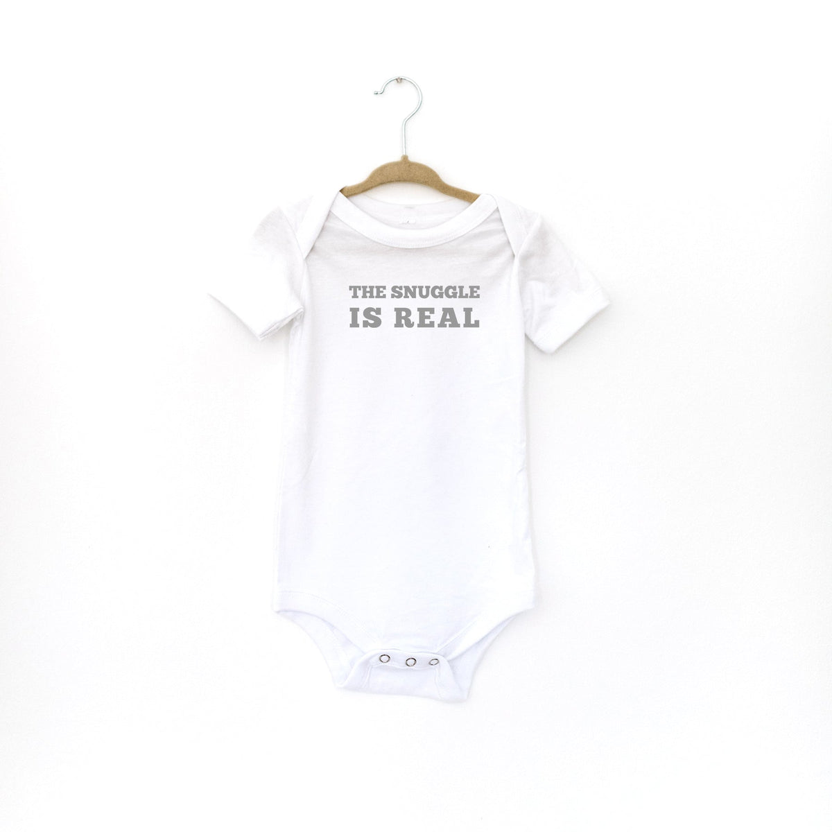 The snuggle is 2024 real baby clothes